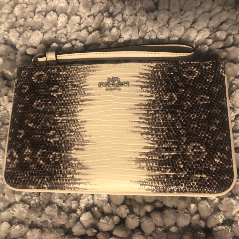 Coach wristlet NWOT with snakeskin design.